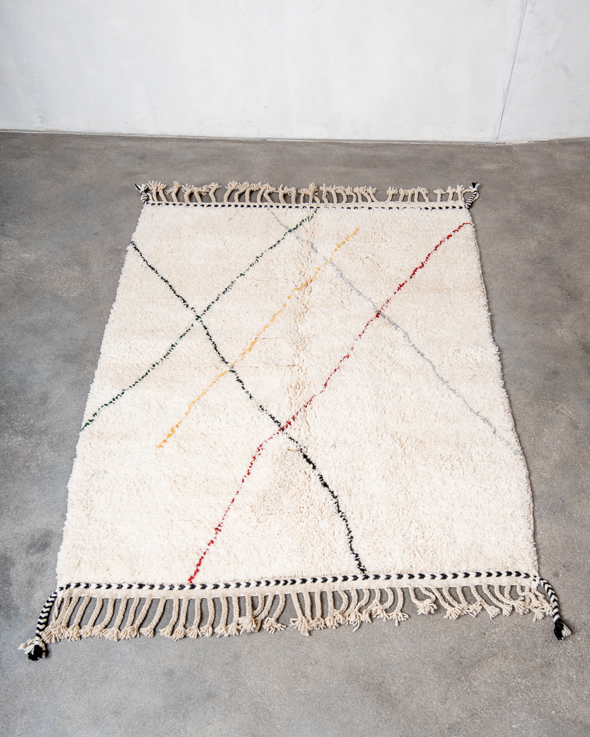 Modern, designer, handcrafted Berber rug from Morocco. Beniourain carpet with beautiful colours and patterns and fluffy wool texture.